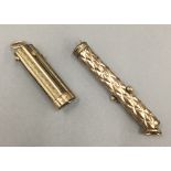 A gilt metal multi-tool retracting etui,