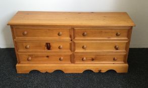 A modern pine chest of drawers