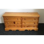 A modern pine chest of drawers