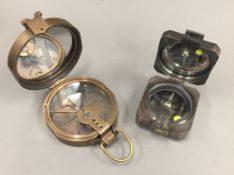 Two brass compasses