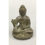 A small bronze model of Buddha