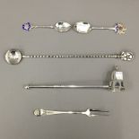A sterling silver candle snuffer, a sterling pickle fork,