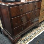 A 20th century walnut chest of drawers