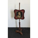 A Victorian mahogany pole screen with tapestry panel