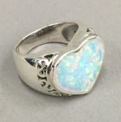 An opal heart shaped ring