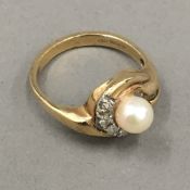 A 9 ct gold pearl and diamond set ring,