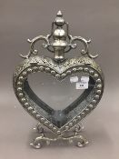 A silvered heart shaped lantern