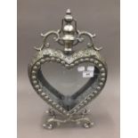 A silvered heart shaped lantern