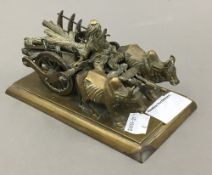 An Indian brass model of oxen pulling a cart