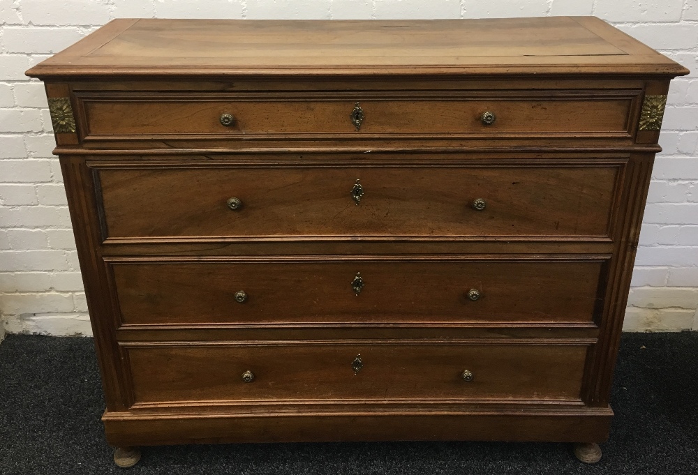 A 19th century French walnut commode The cleated rectangular moulded top above four straight