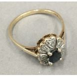 A 9 ct gold diamond and sapphire ring (2.
