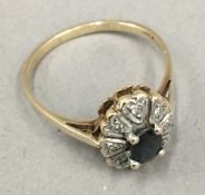 A 9 ct gold diamond and sapphire ring (2.