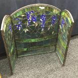 A stained leaded glass triptych fire screen