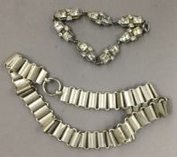 An Art Deco paste set white metal bracelet,