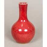 A Chinese porcelain vase, with allover sang de boeuf glaze. 14.5 cm high.