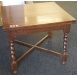 An oak barley twist draw leaf table