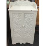 A Victorian painted carved oak cupboard