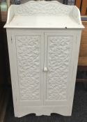 A Victorian painted carved oak cupboard