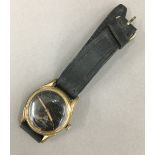 A black faced German wristwatch