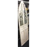 A white painted arched door mirror