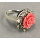 A silver and coral ring