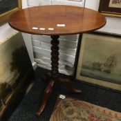 A Victorian mahogany tilt top tripod table