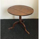 A 19th century tilt top tripod table