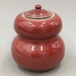A red glazed double gourd Studio pottery lidded pot