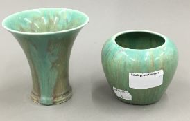 A green glazed flared vase and another similar