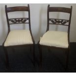 A pair of early 19th century chairs with inlaid top rails