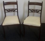 A pair of early 19th century chairs with inlaid top rails