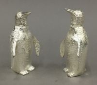 A pair of penguin formed salt and peppers