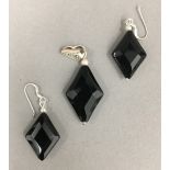 A pair of silver dress earrings and pendant en-suite