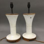 A pair of mid 20th century modernist cast iron table lamps