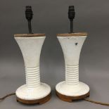 A pair of mid 20th century modernist cast iron table lamps