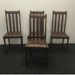 A set of four early 20th century oak dining chairs