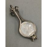 A silver framed Victorian threepence pendant (4 grammes total weight)