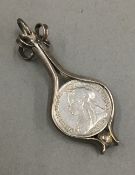 A silver framed Victorian threepence pendant (4 grammes total weight)