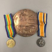 Two WWI service medals and a death plaque