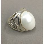 A silver and pearl dress ring