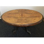 A Victorian walnut loo table