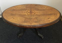 A Victorian walnut loo table