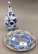 A rare 19th century English pottery blue and white transfer feeding bottle and a 19th century