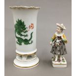 A 19th century hand painted Meissen porcelain vase and a small 19th century German porcelain figure