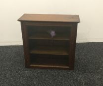 A small glazed oak display cabinet