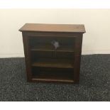 A small glazed oak display cabinet