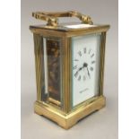 A Mappin and Webb brass cased carriage timepiece