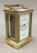 A Mappin and Webb brass cased carriage timepiece