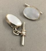 A pair of silver and mother-of-pearl cufflinks