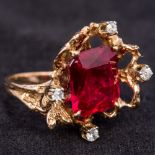 A contemporary unmarked gold, diamond and red stone ring,